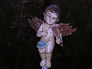 Angel attached to original timber in the 1819 room, previously a prison cell.